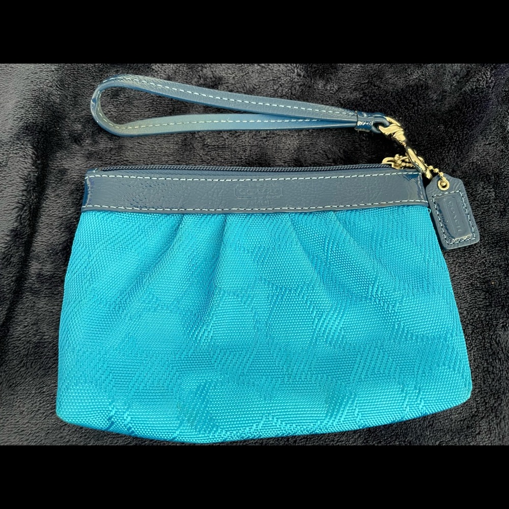 Coach wristlet! Gorgeous turquoise with magenta pink inside.